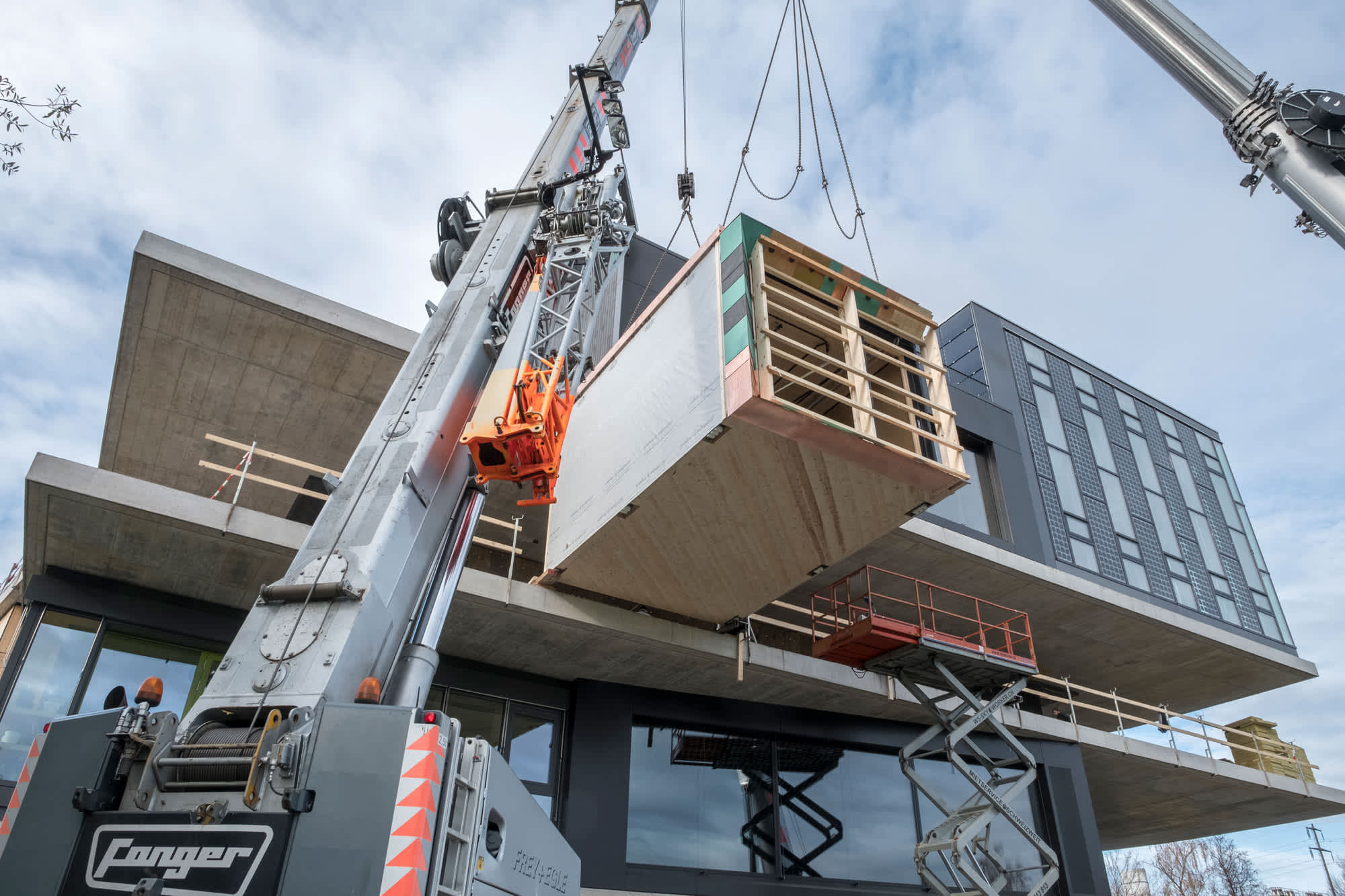 modular building piece being installed in construction project